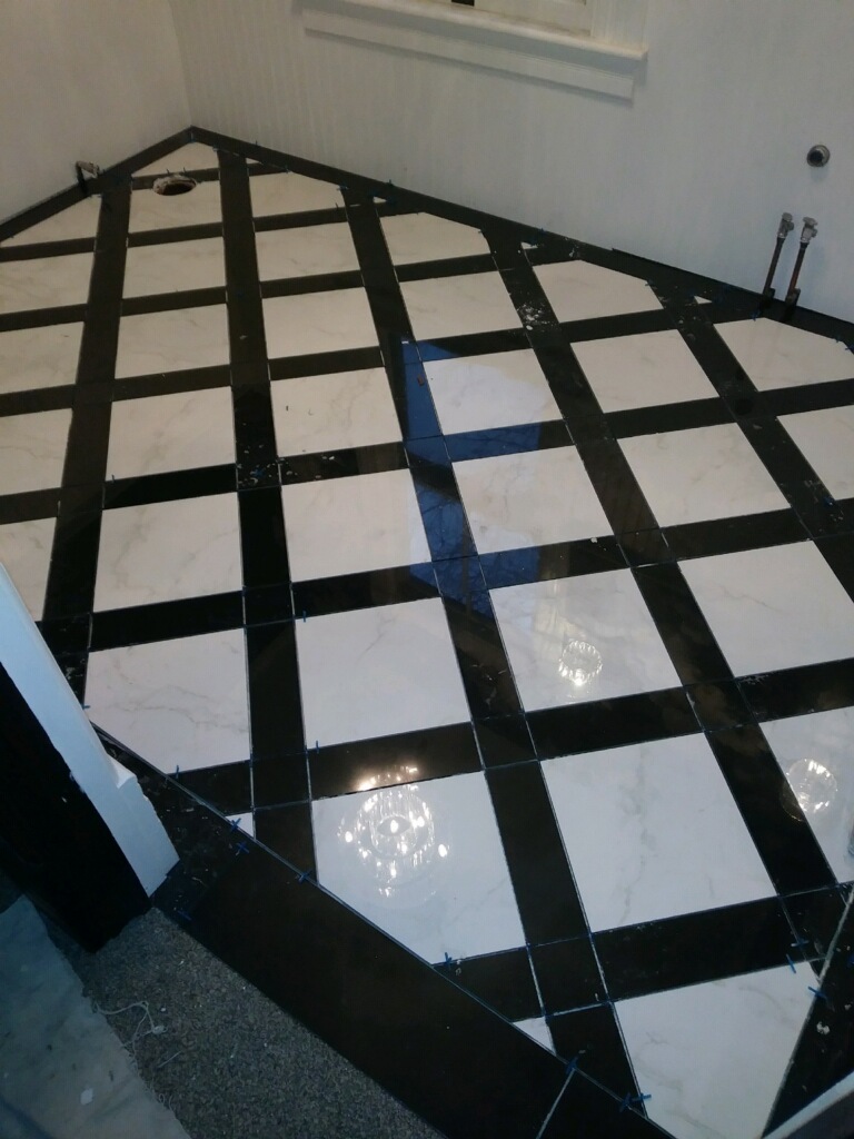 Custom white and black diamond pattern floor design